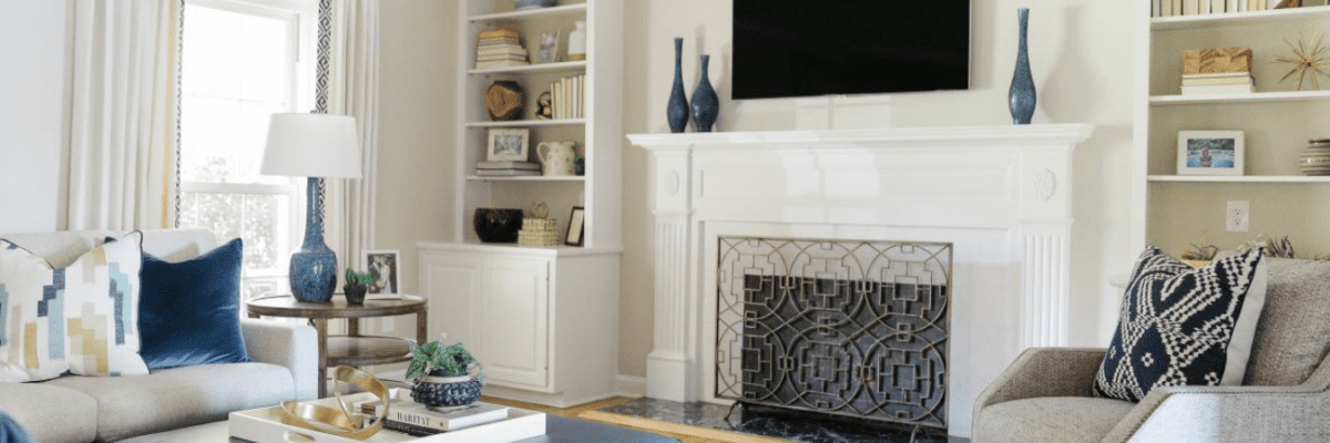 Interior of light living room with blue and white decor.