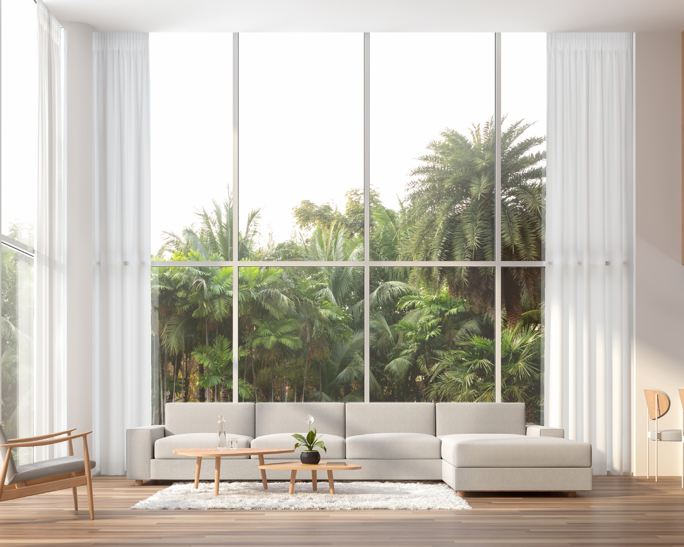 Beautiful, modern coastal living room, with large windows showing palm trees.